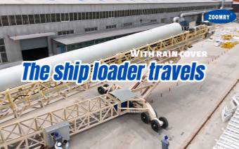 The ship loader travels with rain cover